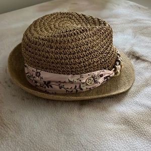 Straw hat trimmed with gold chain & pink print cloth